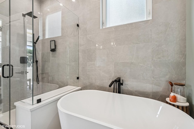 4535 S Evans Ave, Chicago, IL 60653 - full bath featuring a shower stall, tile walls, and a soaking tub