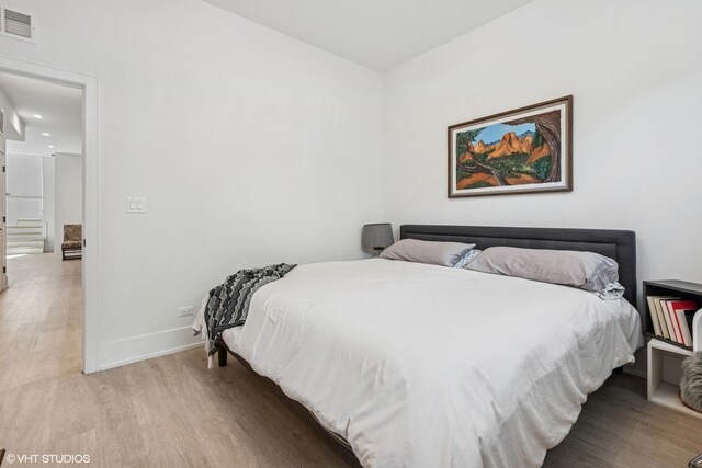 4535 S Evans Ave, Chicago, IL 60653 - bedroom featuring wood finished floors and recessed lighting