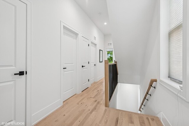 4535 S Evans Ave, Chicago, IL 60653 - corridor with an upstairs landing, recessed lighting, and light wood-style flooring
