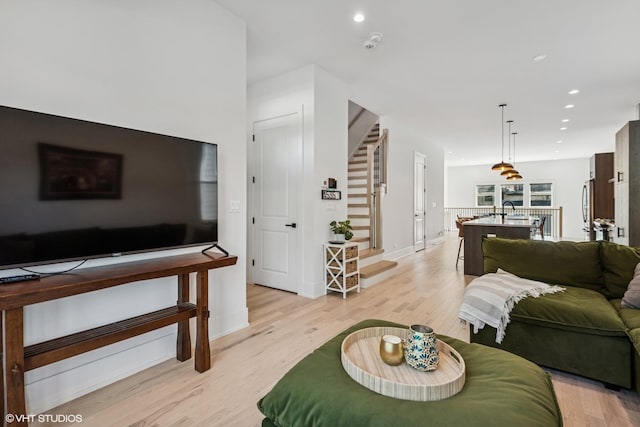 4535 S Evans Ave, Chicago, IL 60653 - living area with light wood-type flooring, stairway, and recessed lighting