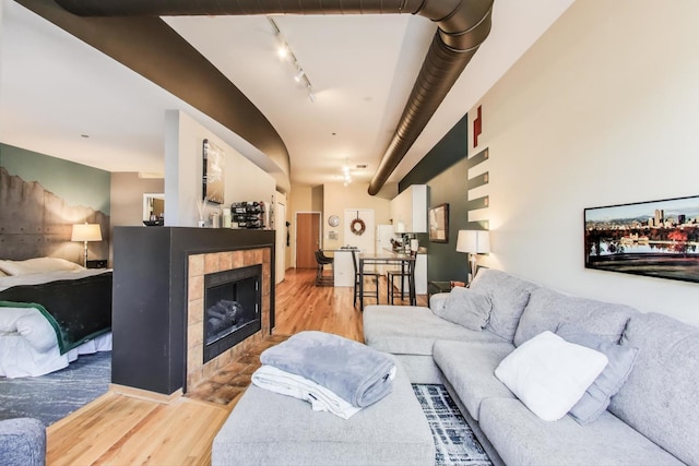 910 S Michigan Ave Unit 1005, Chicago, IL 60605 - living room featuring wood finished floors, a tile fireplace, and rail lighting