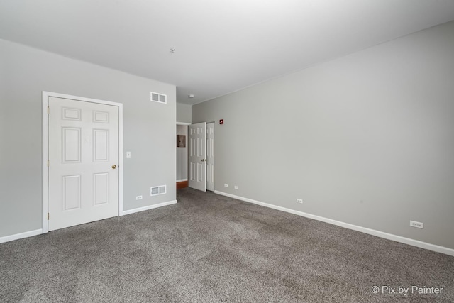 930 Curtiss St Unit 104, Downers Grove, IL 60515 - unfurnished bedroom featuring dark colored carpet and baseboards