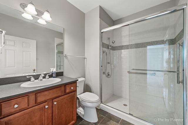 930 Curtiss St Unit 104, Downers Grove, IL 60515 - full bath with a stall shower, tile patterned flooring, and vanity