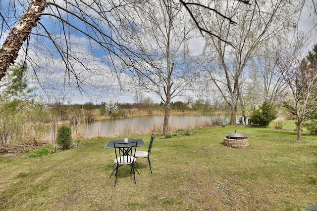 2146 Prairie Trl, Round Lake Heights, IL 60073 - view of grassy yard featuring an outdoor fire pit and a water view