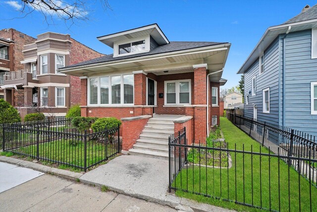 7719 S Morgan St, Chicago, IL 60620 - view of front of home featuring brick siding and a fenced front yard