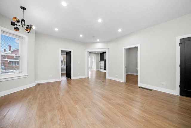 7719 S Morgan St, Chicago, IL 60620 - unfurnished living room with a chandelier, light wood finished floors, and recessed lighting
