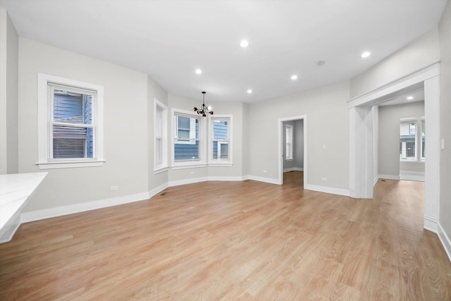 7719 S Morgan St, Chicago, IL 60620 - unfurnished living room featuring a chandelier, light wood-type flooring, and recessed lighting