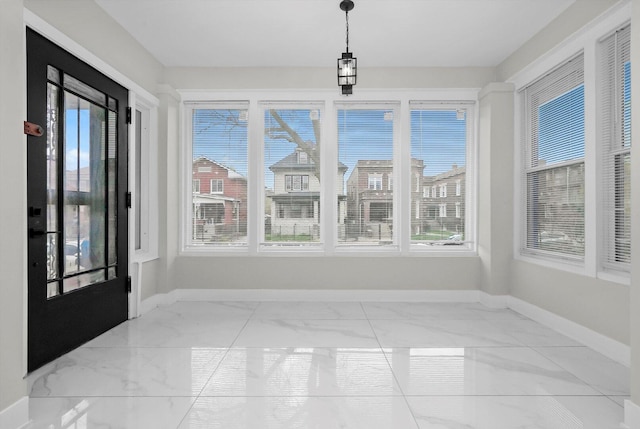 7719 S Morgan St, Chicago, IL 60620 - unfurnished sunroom with marble look tiles and healthy amount of natural light