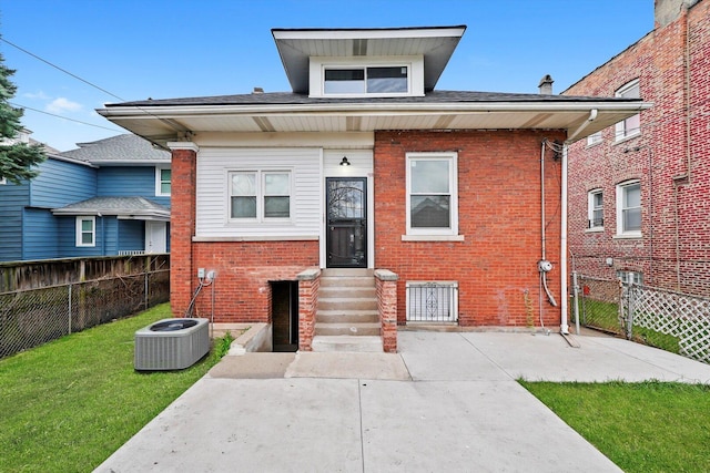 7719 S Morgan St, Chicago, IL 60620 - view of front of property with entry steps, a fenced backyard, brick siding, and a patio