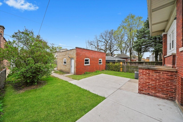 7719 S Morgan St, Chicago, IL 60620 - fenced backyard with an outdoor structure and a patio