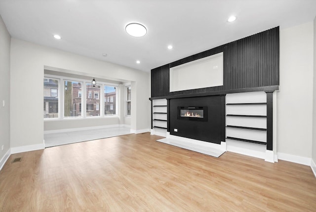 7719 S Morgan St, Chicago, IL 60620 - unfurnished living room featuring a fireplace, wood finished floors, and recessed lighting