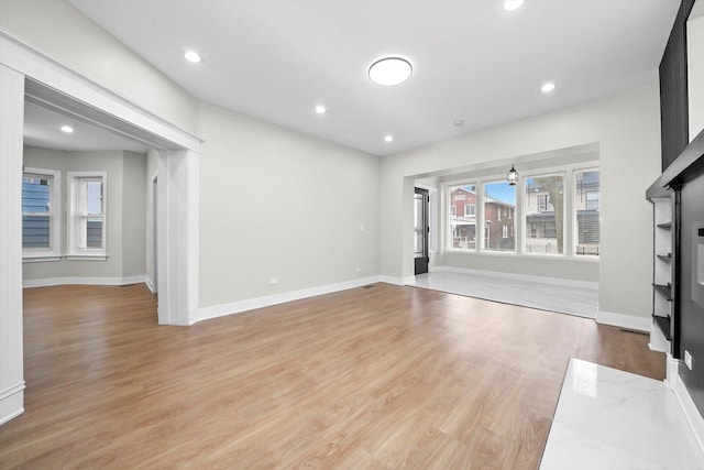 7719 S Morgan St, Chicago, IL 60620 - unfurnished living room featuring light wood-style floors and recessed lighting