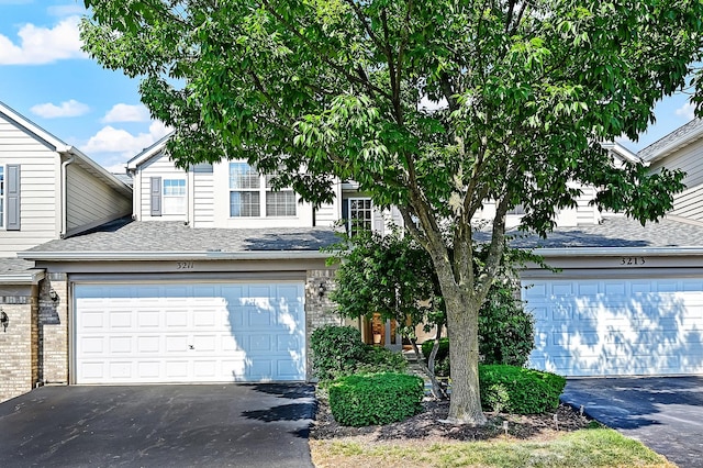 3211 Foxridge Ct, Woodridge, IL 60517 - view of property hidden behind natural elements with asphalt driveway, brick siding, and roof with shingles