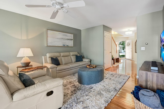 3211 Foxridge Ct, Woodridge, IL 60517 - living room featuring light wood-style flooring, ceiling fan, and stairs