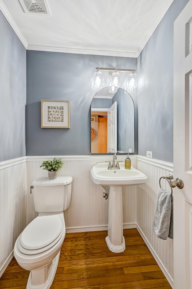 3211 Foxridge Ct, Woodridge, IL 60517 - half bath with a wainscoted wall, wood finished floors, and ornamental molding