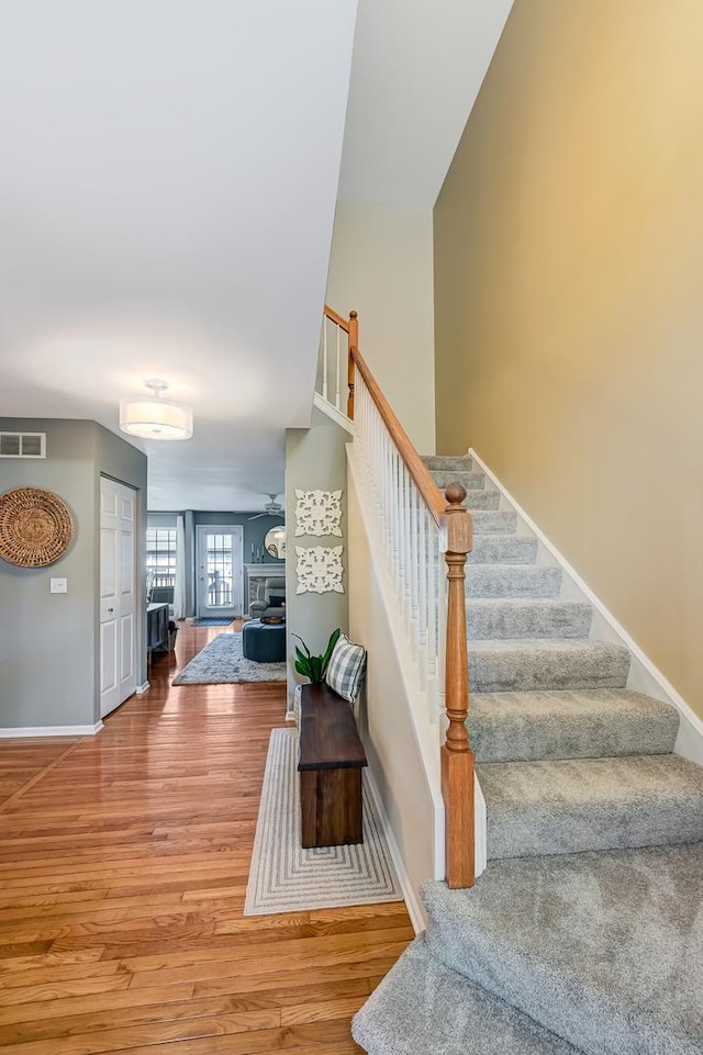 3211 Foxridge Ct, Woodridge, IL 60517 - stairway featuring wood finished floors and a fireplace