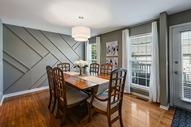 3211 Foxridge Ct, Woodridge, IL 60517 - dining room featuring light wood-style floors and a decorative wall