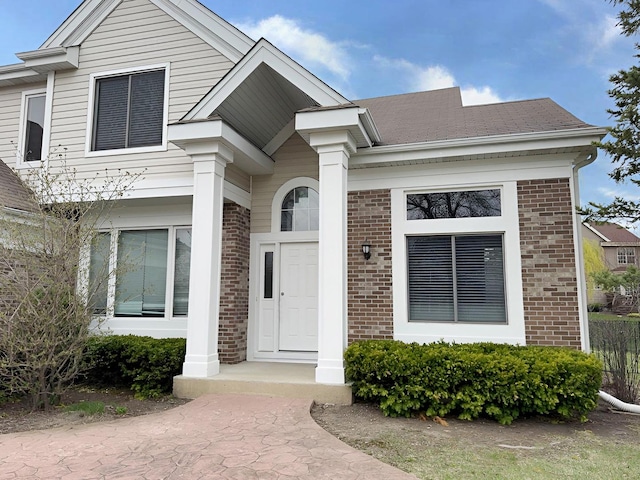 1214 Eric Ln, Lake Zurich, IL 60047 - view of front facade featuring brick siding
