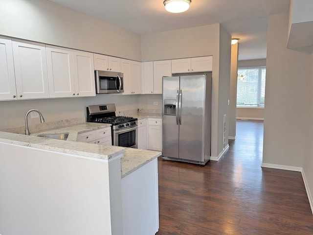 1214 Eric Ln, Lake Zurich, IL 60047 - kitchen featuring stainless steel appliances, light stone counters, dark wood finished floors, and white cabinetry