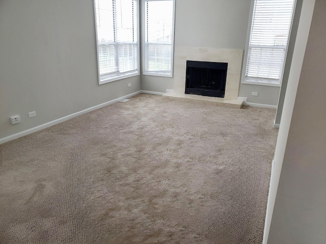 1214 Eric Ln, Lake Zurich, IL 60047 - unfurnished living room with plenty of natural light, carpet floors, and a premium fireplace