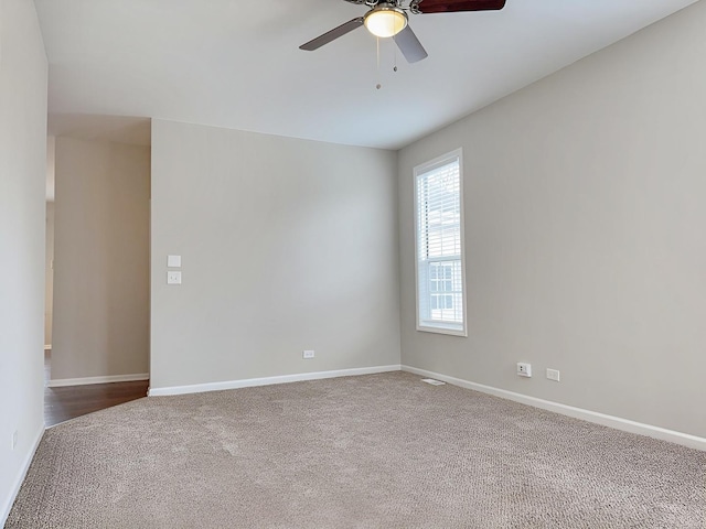 1214 Eric Ln, Lake Zurich, IL 60047 - empty room with dark colored carpet and a ceiling fan