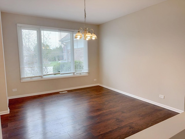 1214 Eric Ln, Lake Zurich, IL 60047 - unfurnished room with a chandelier and dark wood-style flooring
