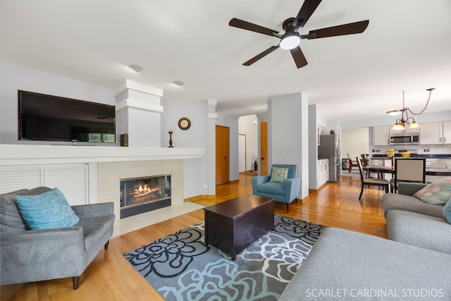 908 Pimpernel Ct, Naperville, IL 60540 - living area with a ceiling fan, light wood-type flooring, and a fireplace