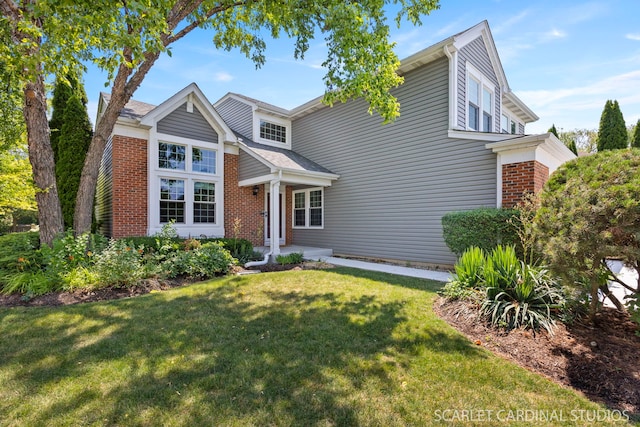 908 Pimpernel Ct, Naperville, IL 60540 - traditional-style home featuring a front yard and brick siding