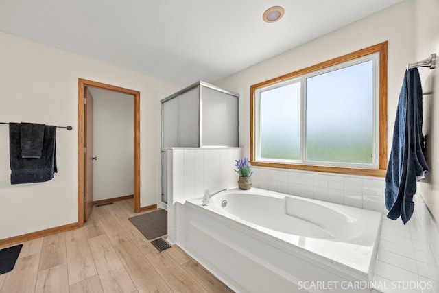 908 Pimpernel Ct, Naperville, IL 60540 - bathroom featuring a bath, a shower stall, and wood finished floors