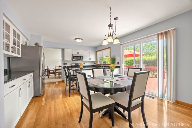 908 Pimpernel Ct, Naperville, IL 60540 - dining area featuring light wood-style floors and a chandelier
