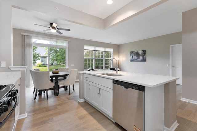 13315 Red Alder Ave, Huntley, IL 60142 - kitchen with dishwasher, gas range oven, light wood-style floors, a ceiling fan, and an island with sink