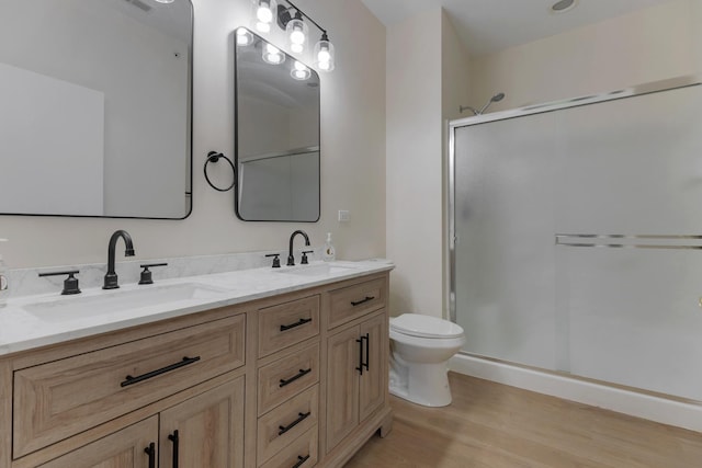 13315 Red Alder Ave, Huntley, IL 60142 - bathroom with wood finished floors, double vanity, and a shower stall