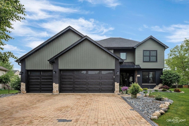 25048 Michele Dr, Plainfield, IL 60544 - view of front facade featuring an attached garage, decorative driveway, a front yard, and stone siding