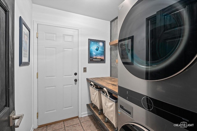 25048 Michele Dr, Plainfield, IL 60544 - washroom featuring estacked washer and dryer and light tile patterned flooring