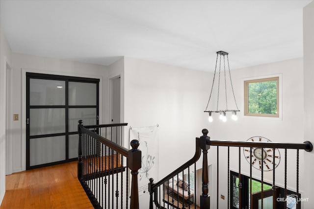 25048 Michele Dr, Plainfield, IL 60544 - corridor with an upstairs landing, wood finished floors, and a chandelier