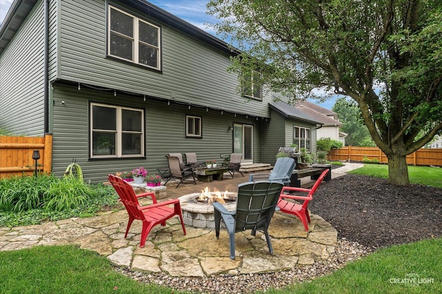 25048 Michele Dr, Plainfield, IL 60544 - rear view of property featuring a fire pit, a fenced backyard, and a patio area