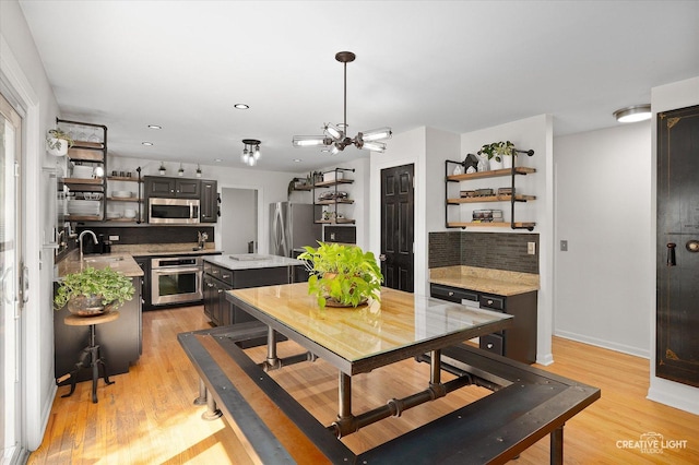 25048 Michele Dr, Plainfield, IL 60544 - dining area with light wood-type flooring, recessed lighting, and a chandelier