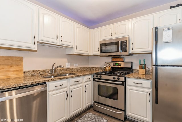 1505 Raymond Dr Unit 103, Naperville, IL 60563 - kitchen with stainless steel appliances, white cabinetry, and light stone countertops
