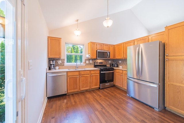 2211 Aspen Dr, Woodstock, IL 60098 - kitchen featuring appliances with stainless steel finishes, light countertops, tasteful backsplash, and high vaulted ceiling