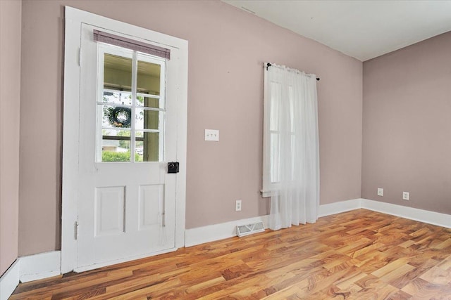 605 W 2nd N St, Wenona, IL 61377 - foyer entrance featuring light wood-style floors and baseboards
