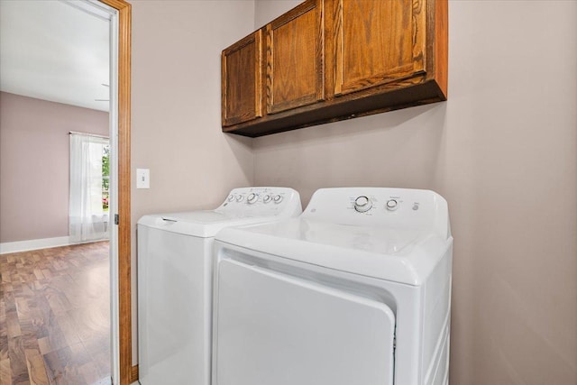 605 W 2nd N St, Wenona, IL 61377 - laundry room with cabinet space, separate washer and dryer, and wood finished floors