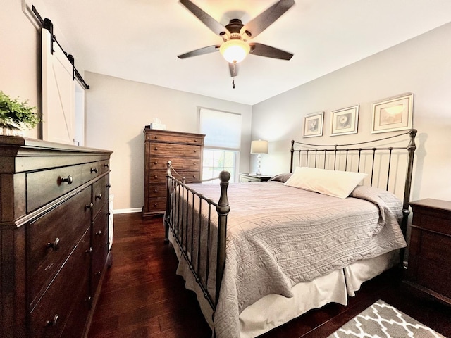 14011 Creek Crossing Dr, Orland Park, IL 60467 - bedroom with dark wood-style flooring, a ceiling fan, and a barn door