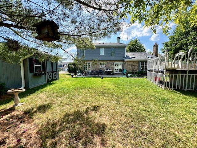 14011 Creek Crossing Dr, Orland Park, IL 60467 - back of house with a yard, an outdoor structure, a chimney, a deck, and a patio