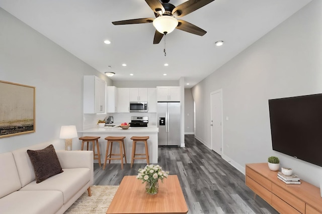 6349 S Maryland Ave, Chicago, IL 60637 - living area with dark wood finished floors, a ceiling fan, and recessed lighting