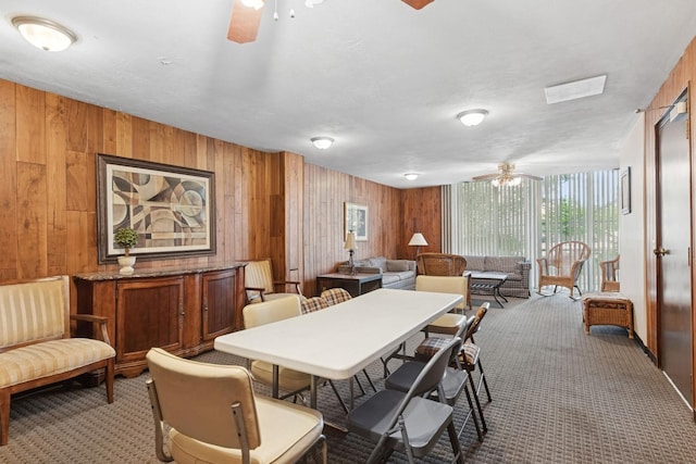 424 Park Ave Unit 604, River Forest, IL 60305 - carpeted dining space featuring a ceiling fan and wood walls
