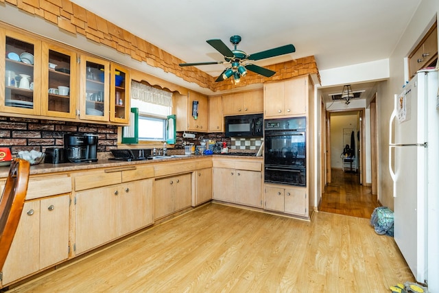 8825 S Richmond Ave, Evergreen Park, IL 60805 - kitchen featuring black appliances, a warming drawer, light wood finished floors, backsplash, and ceiling fan