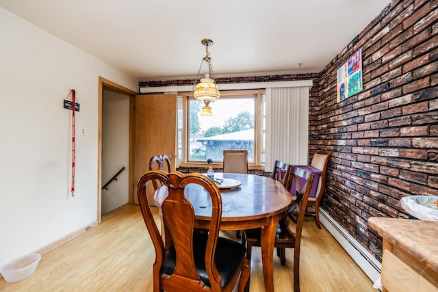 8825 S Richmond Ave, Evergreen Park, IL 60805 - dining room featuring baseboard heating, light wood-type flooring, and brick wall