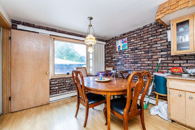8825 S Richmond Ave, Evergreen Park, IL 60805 - dining space featuring brick wall, a baseboard radiator, and light wood-style floors