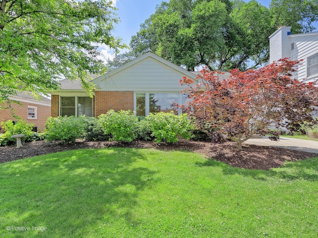 610 S Madison Ave, La Grange, IL 60525 - view of front of property featuring a front lawn and brick siding