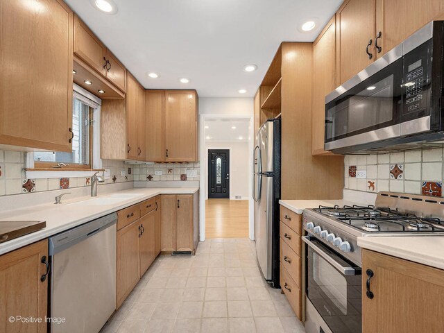 610 S Madison Ave, La Grange, IL 60525 - kitchen with stainless steel appliances, backsplash, light countertops, recessed lighting, and open shelves